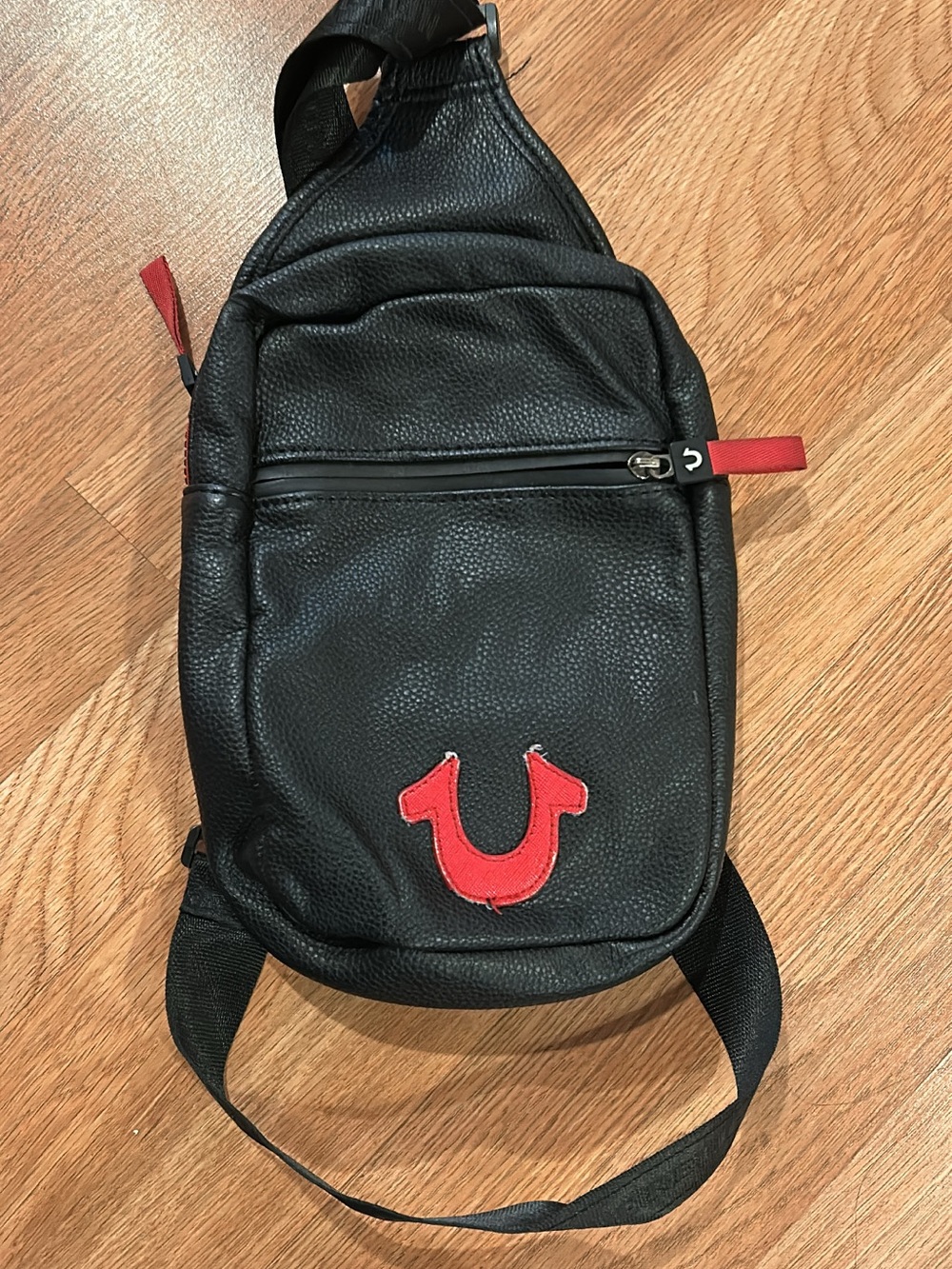 Black Leather Sling Bag with Red Accent